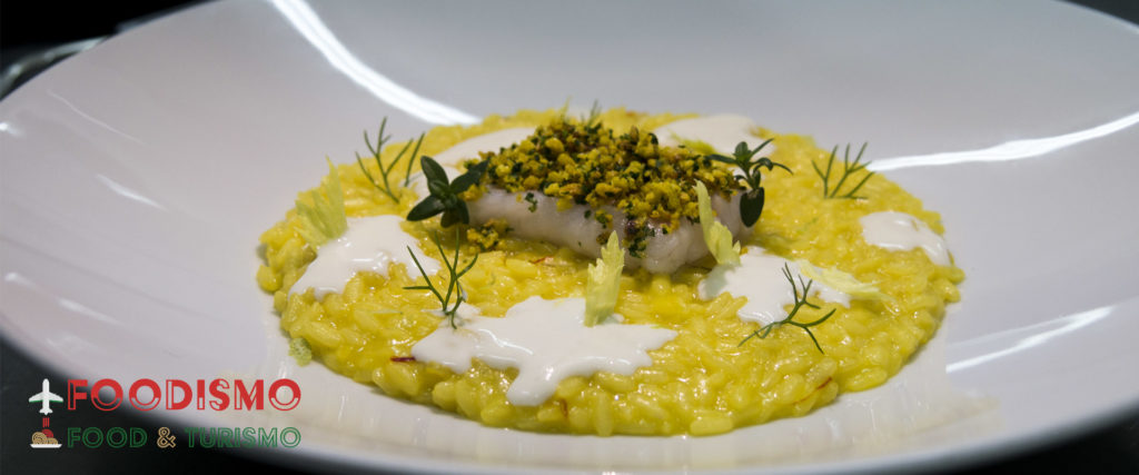 Risotto allo zafferano del Salento con fonduta al parmigiano e merluzzo di Otranto confit,